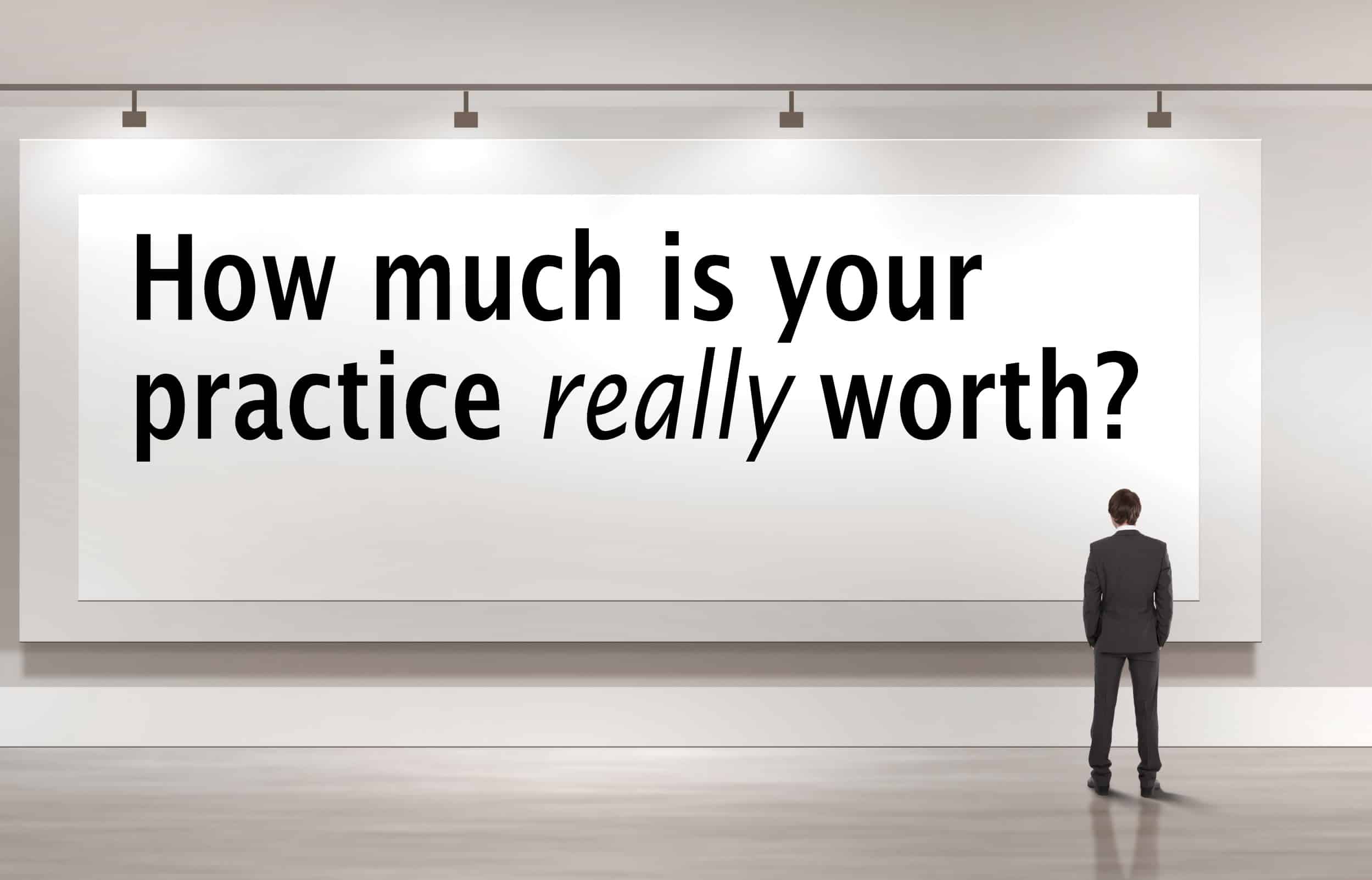 photograph of a man in front of a sign.  The sign reads "How much is your practice really worth?"